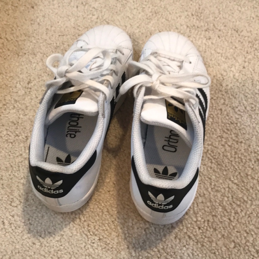 Girls adidas white sneakers with black stripes